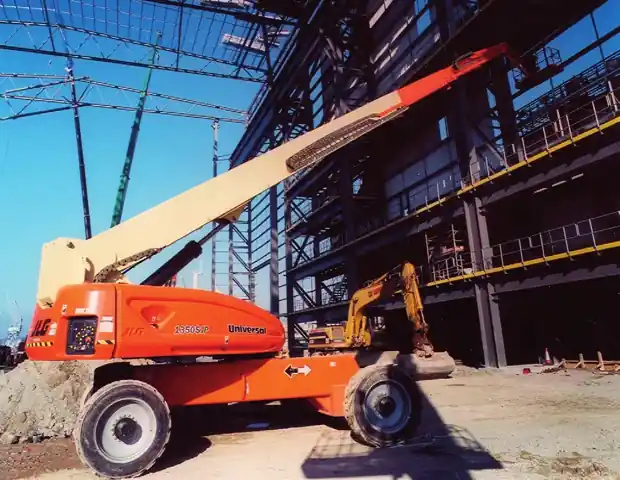 Telescopic boom lift working on a steel-frame building site